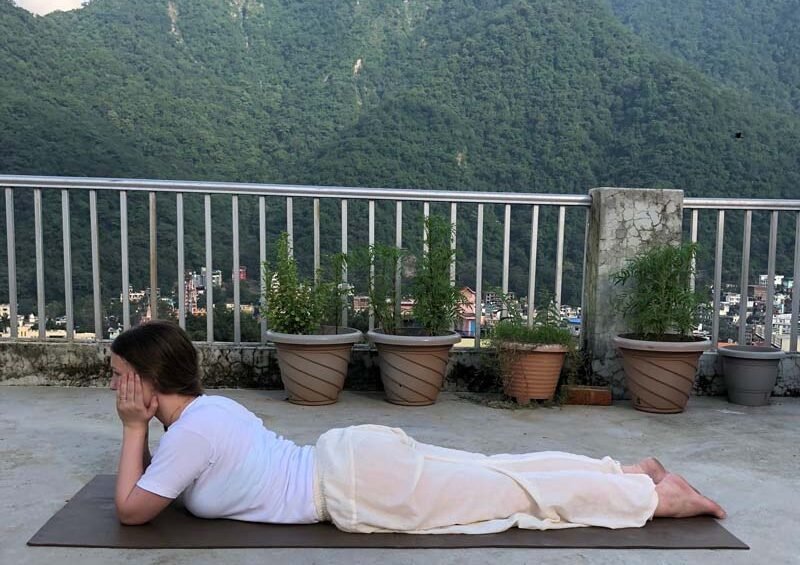 Yoga practitioner practicing Makarasana