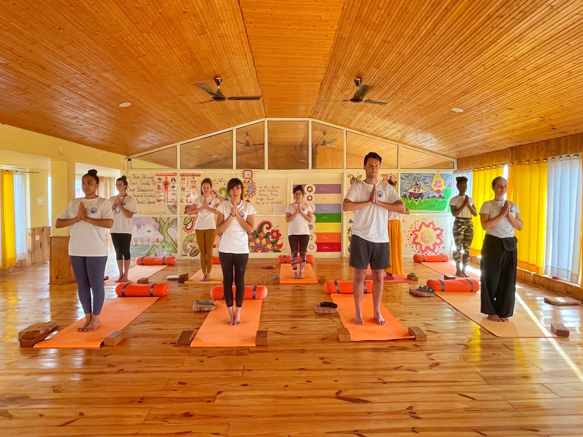 student performing yoga at yoga india foundation